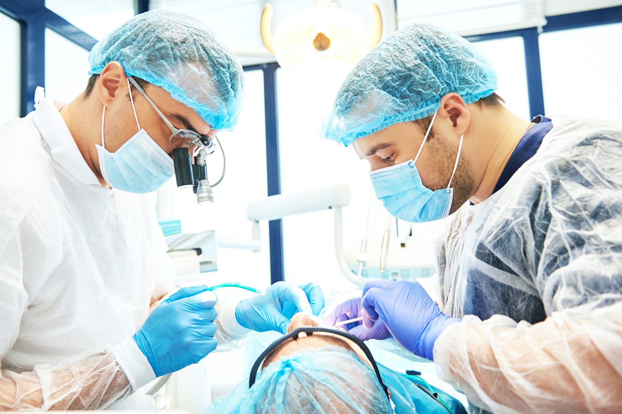 Dentist In Uniform Perform Operation At Dentistry Office