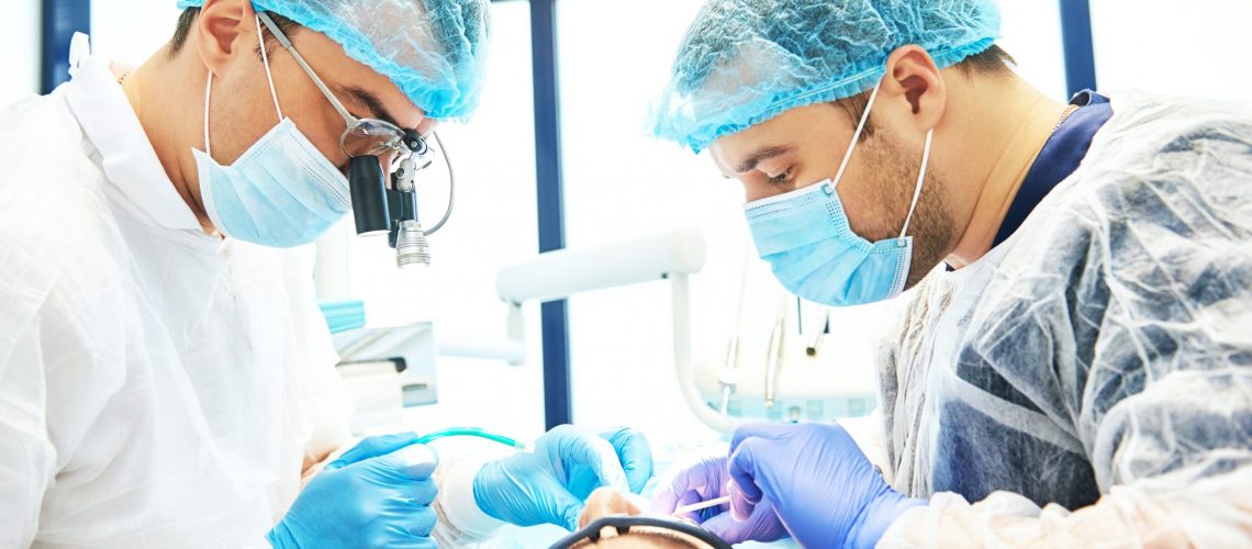 Dentist In Uniform Perform Operation At Dentistry Office